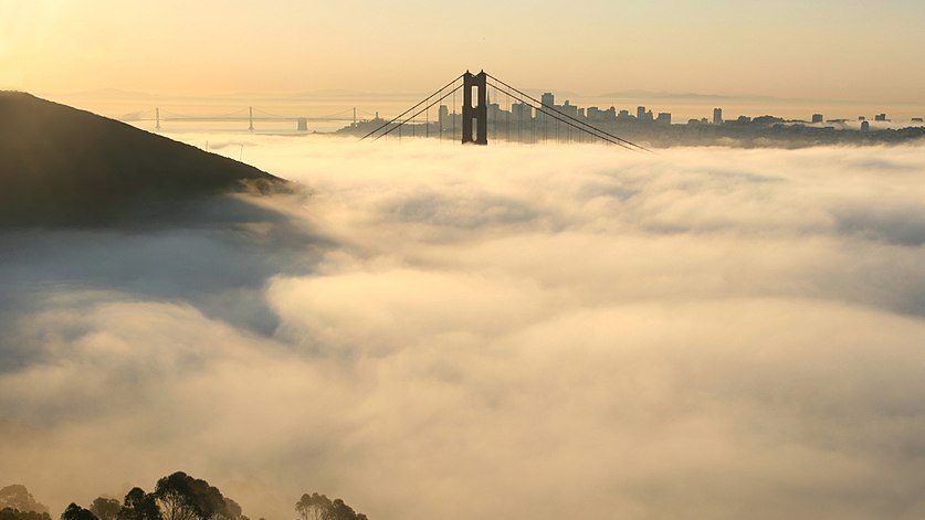 Bay Bridge and Golden Gate Bridge and San Francisco in fog-Photo Credit: Brocken Inaglory